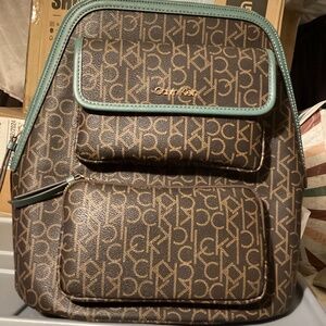 Calvin Klein logo backpack purse with green accents MSRP $178.00